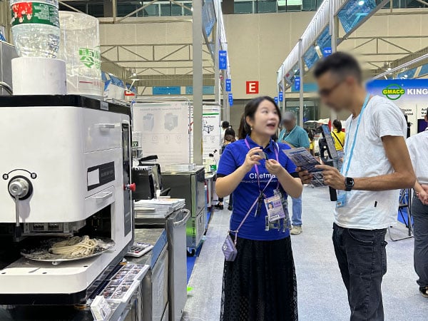 Staff explaining the equipment to visitors