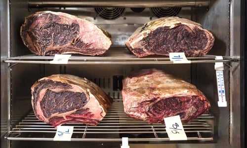 What is the difference between a dry age fridge and a regular fridge?