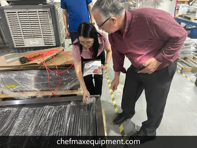 Customers visit the packing area of the factory