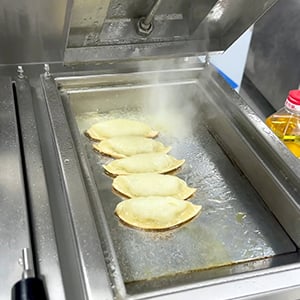 Dumplings in the fried dumpling machine